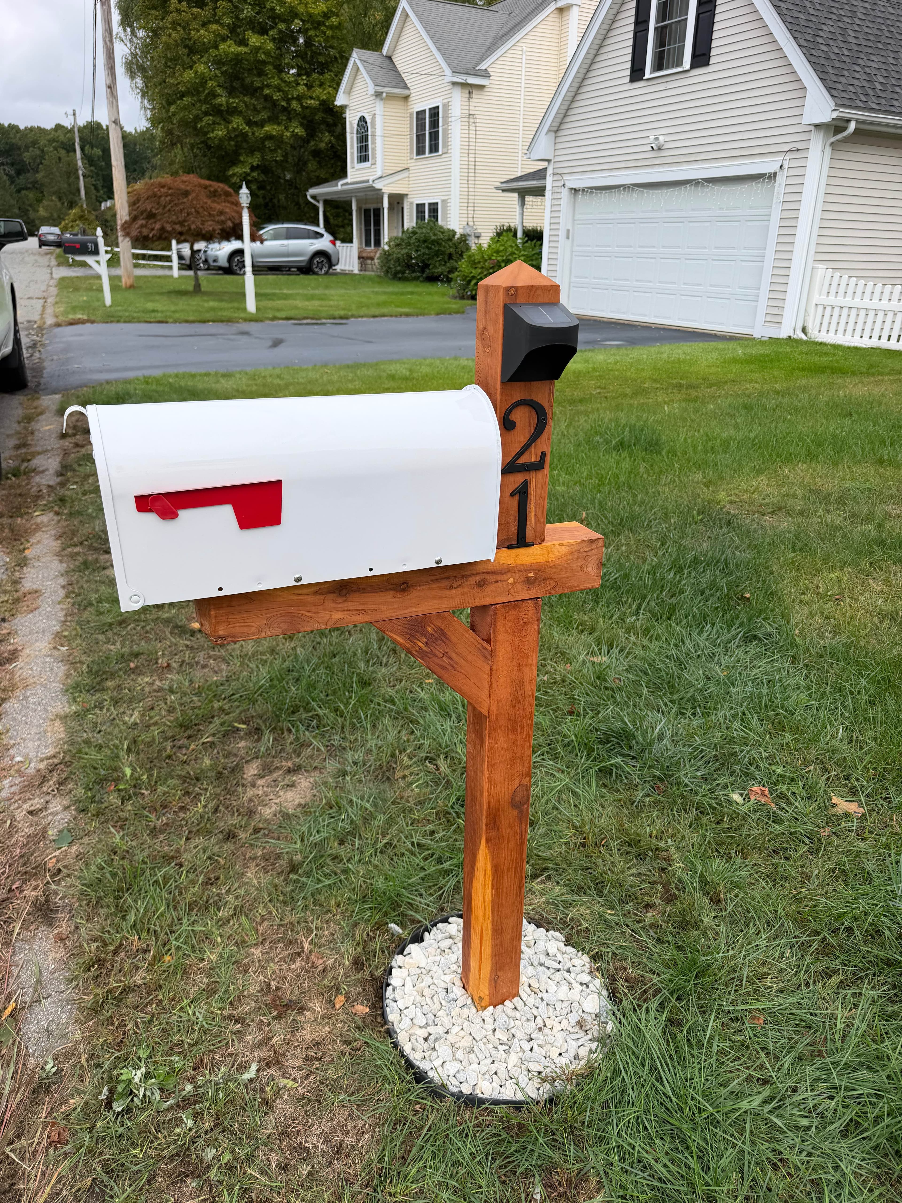 Mr Box treated cedar wood mailbox post with a white mailbox, solar light, and address numbers